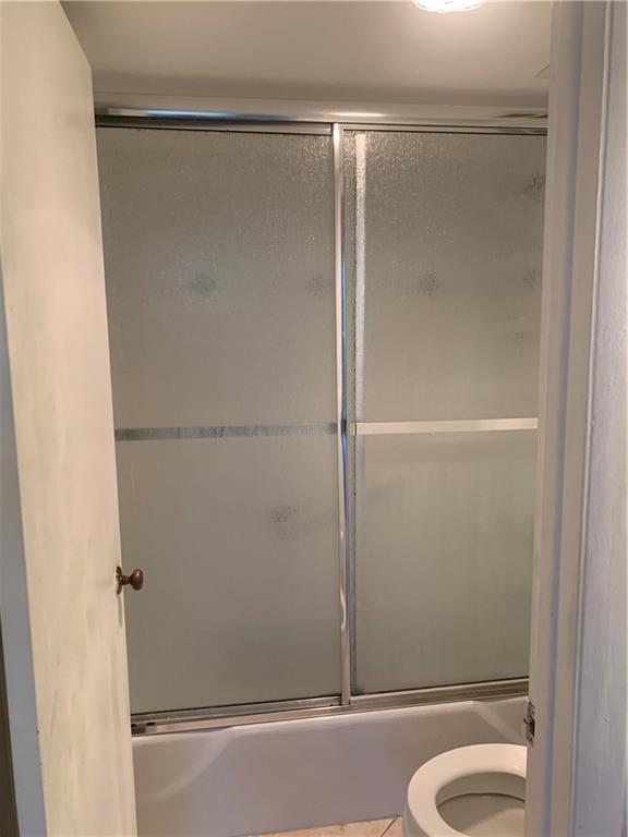 3710 Inverrary Drive, Unit 2U Lauderhill, FL 33319 - Photo 17 of 17 a bathroom with a glass shower door