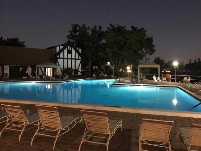 a view of house with swimming pool and outdoor space