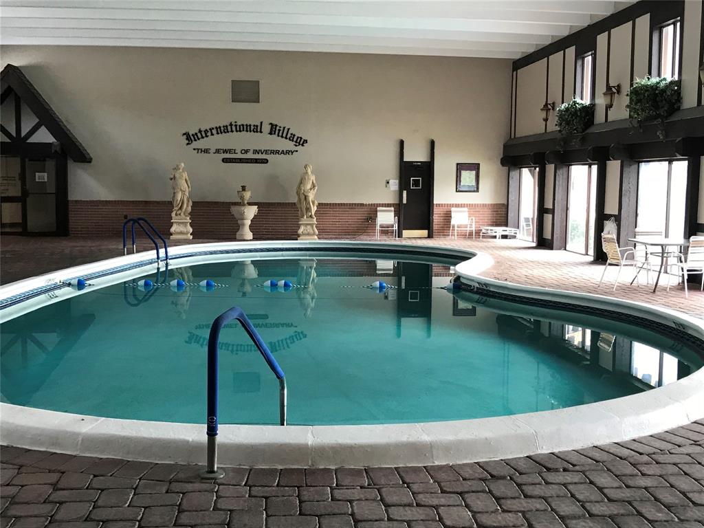 3710 Inverrary Drive, Unit 2U Lauderhill, FL 33319 - Photo 5 of 17 a kitchen with a sink a counter and chairs