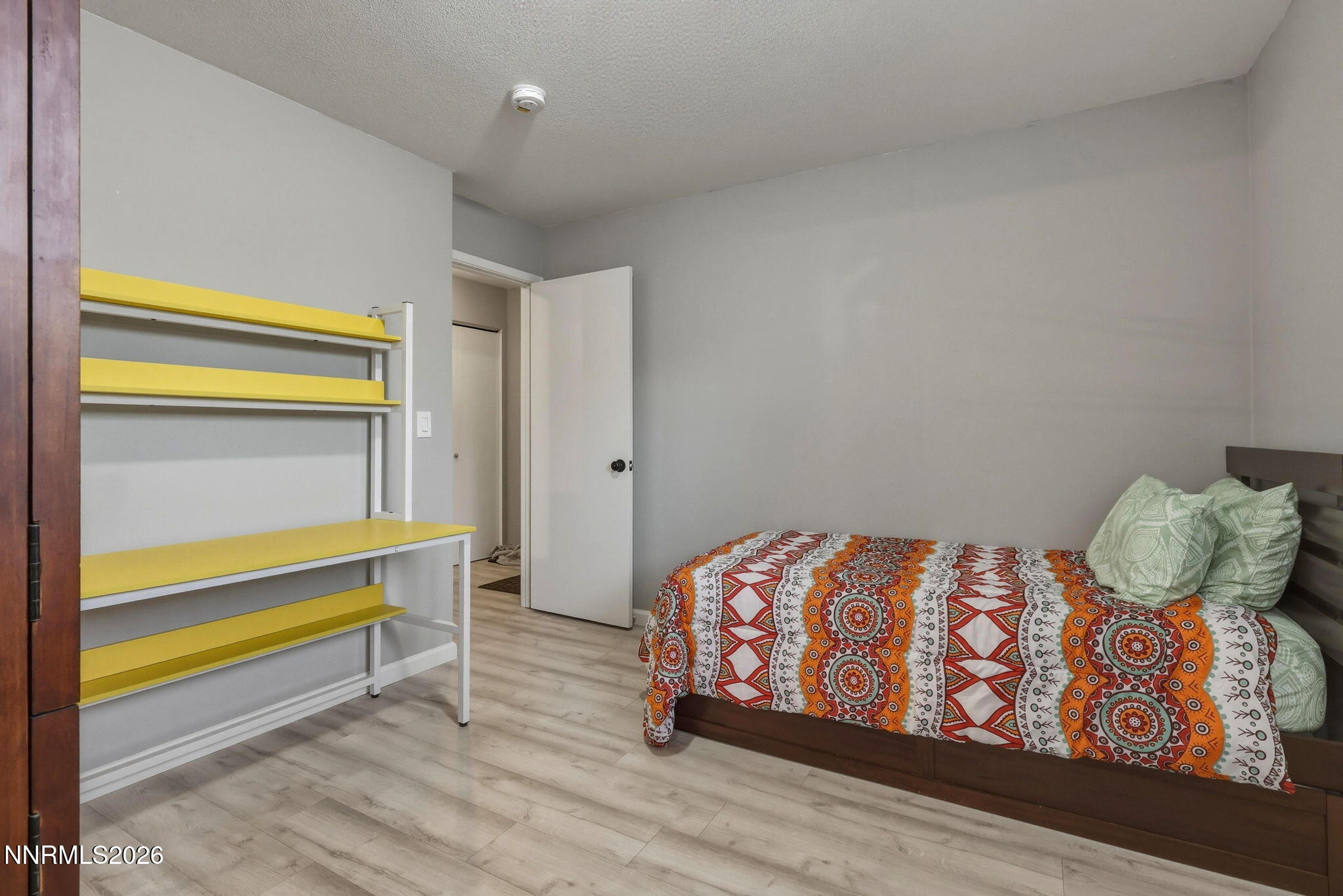 4557 Reggie Road Reno, NV 89502 - Photo 12 of 25 a bedroom with a bed and a window