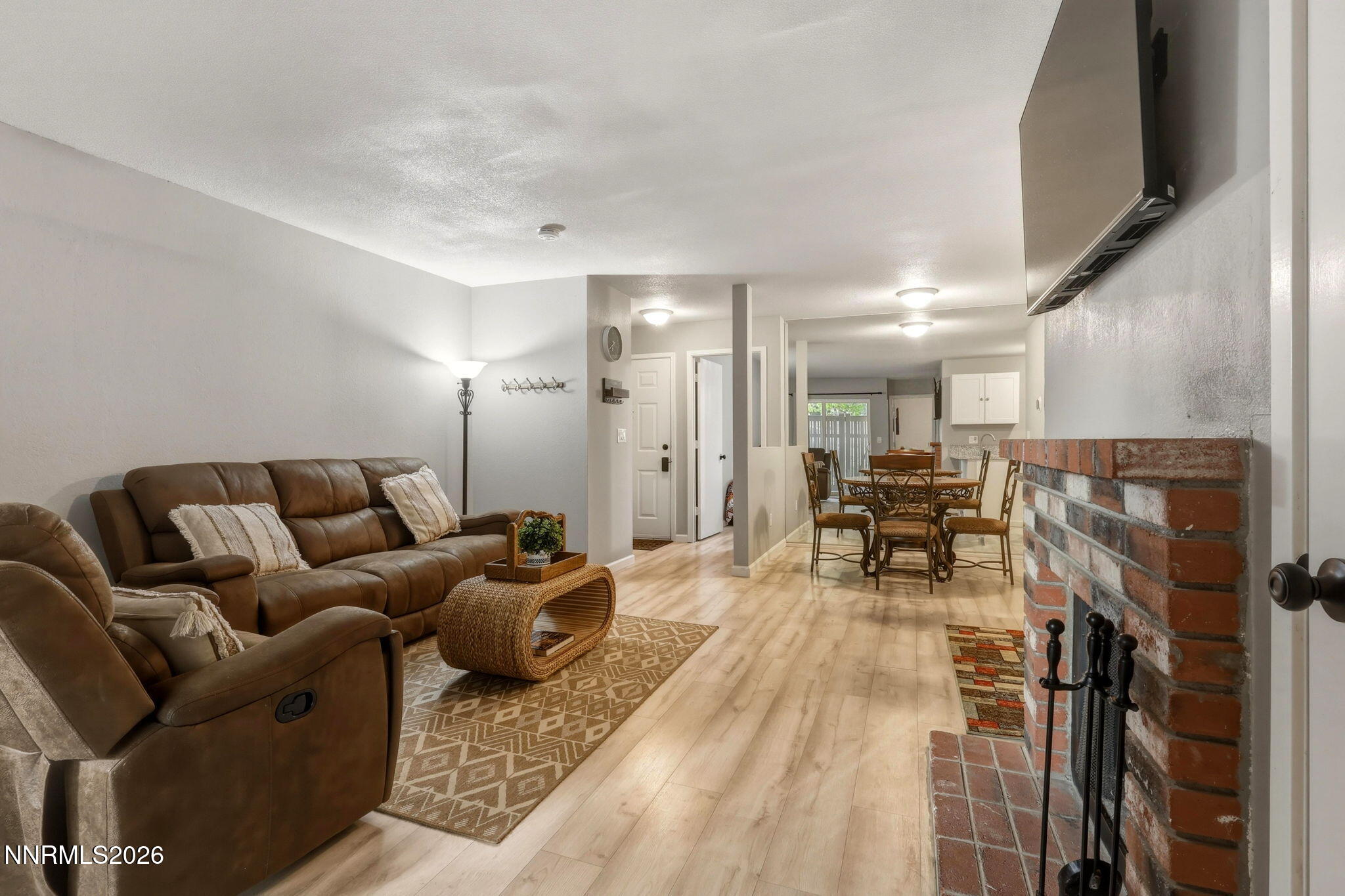 4557 Reggie Road Reno, NV 89502 - Photo 2 of 25 a living room with furniture and a table