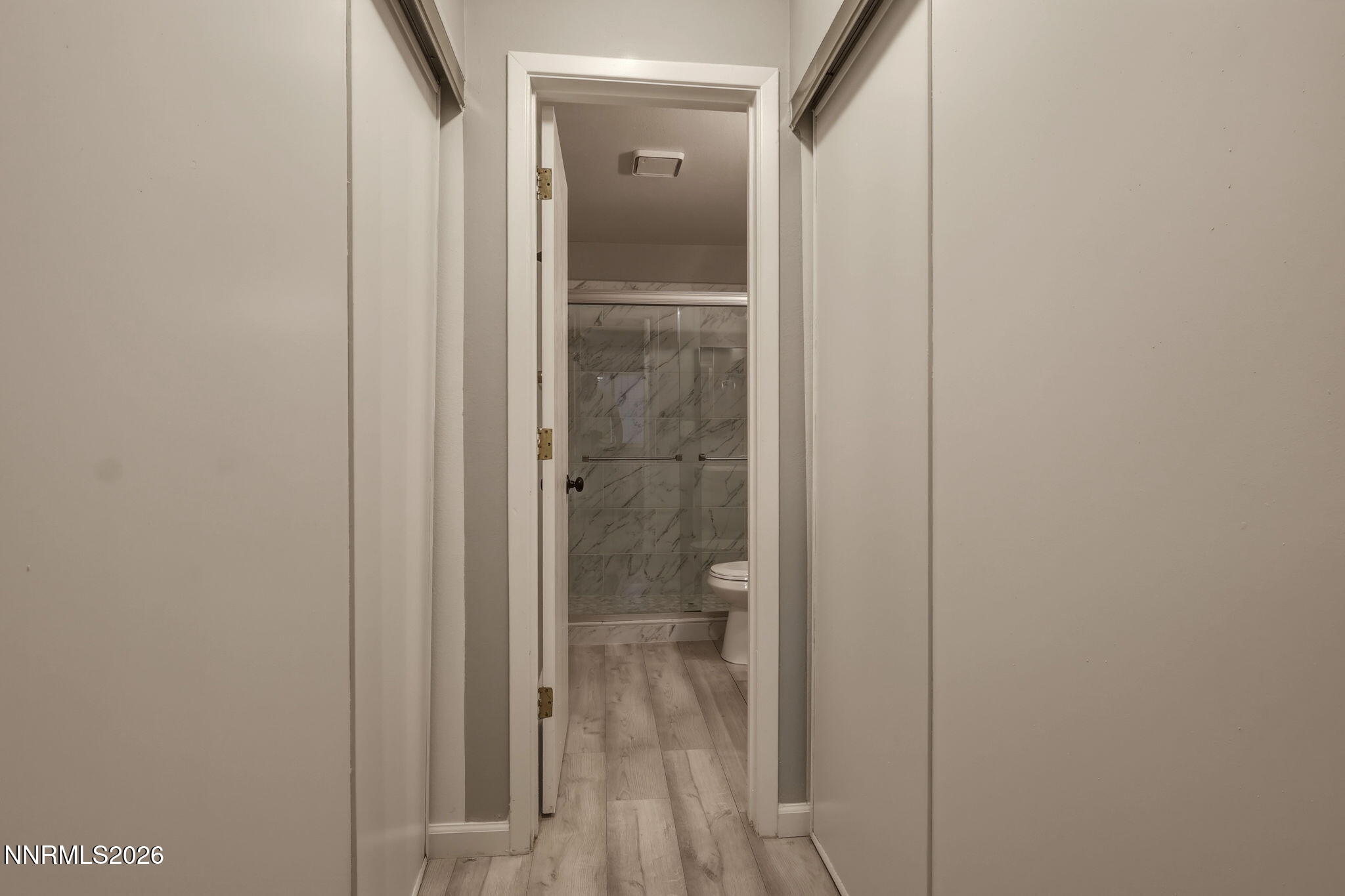 4557 Reggie Road Reno, NV 89502 - Photo 3 of 25 a bathroom with a glass shower door