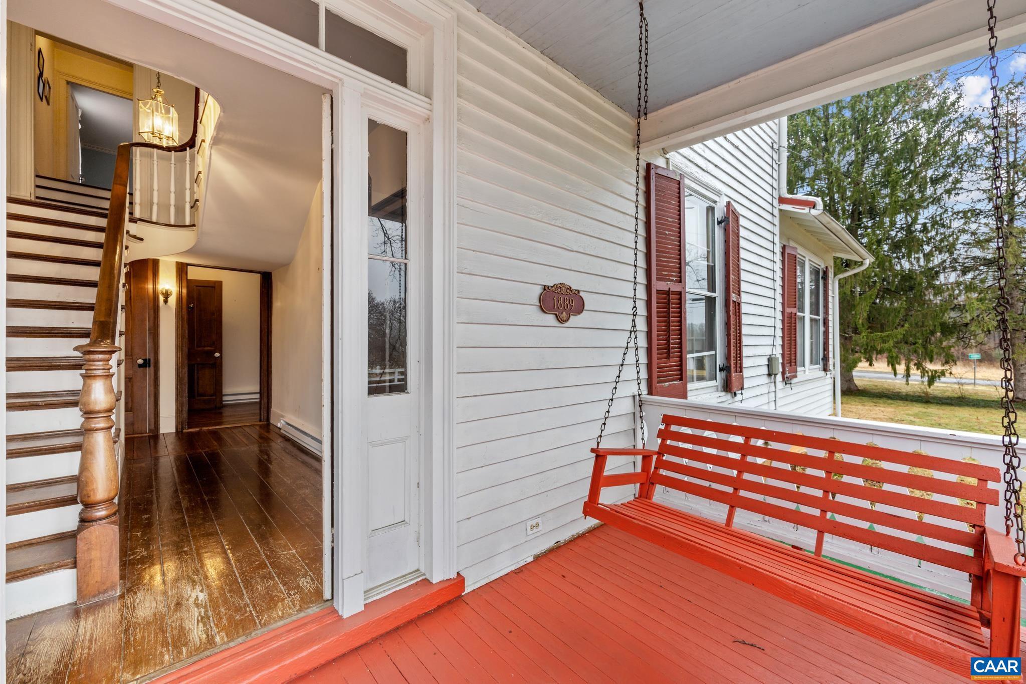 9451 Black Walnut Run Road Rhoadesville, VA 22542 - Photo 13 of 72 a view of a house with a porch