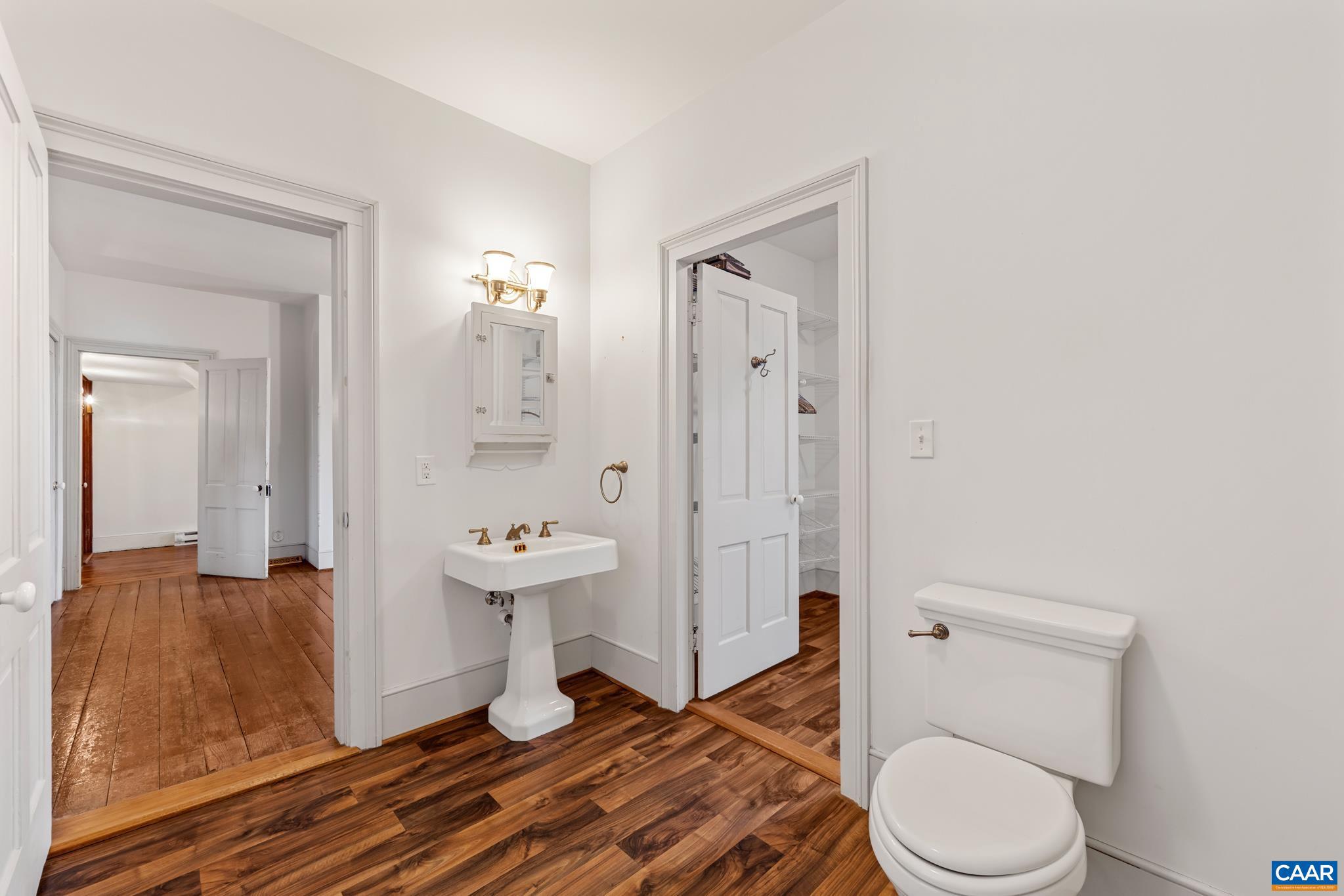 9451 Black Walnut Run Road Rhoadesville, VA 22542 - Photo 37 of 72 a bathroom with a sink a toilet and shower