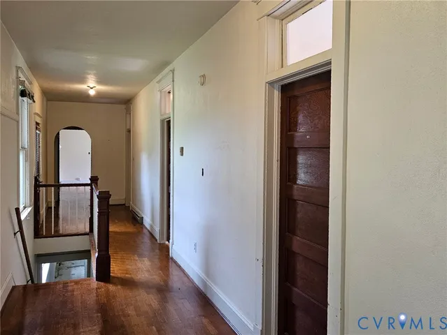 a view of room with a fireplace and a window