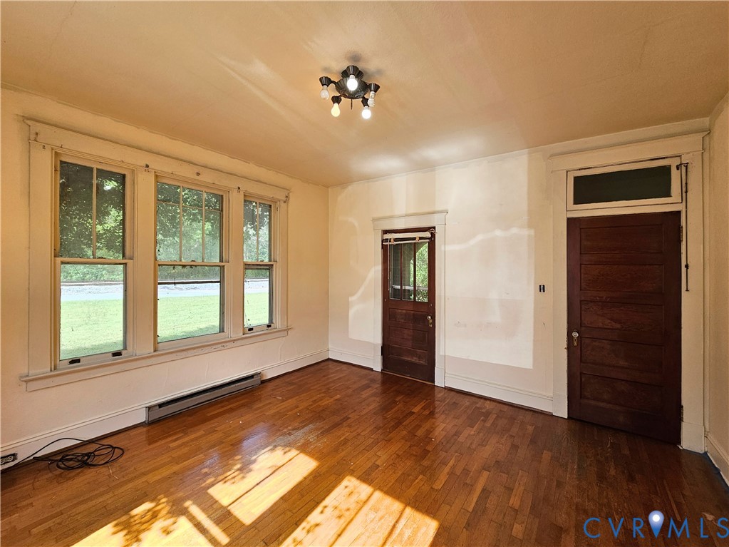 16124 Beaverdam School Road Beaverdam, VA 23015 - Photo 24 of 50 a view of an empty room with a window and wooden floor