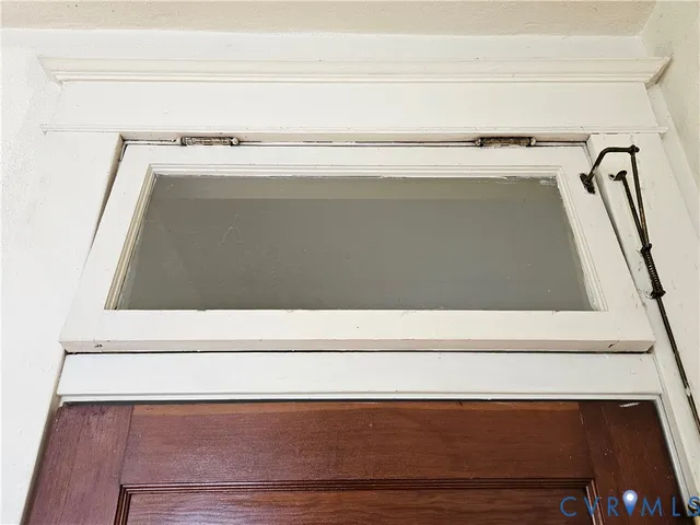 a view of a room that has a large window