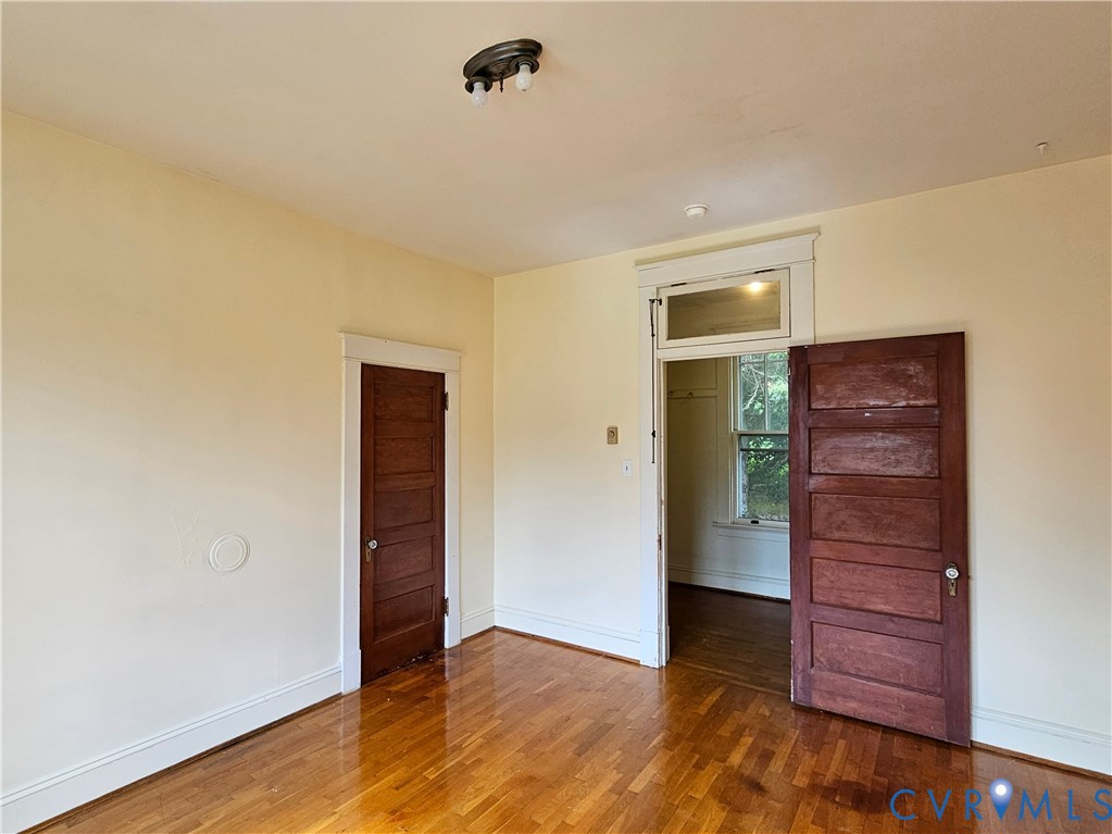 16124 Beaverdam School Road Beaverdam, VA 23015 - Photo 28 of 50 an empty room with closet and wooden floor