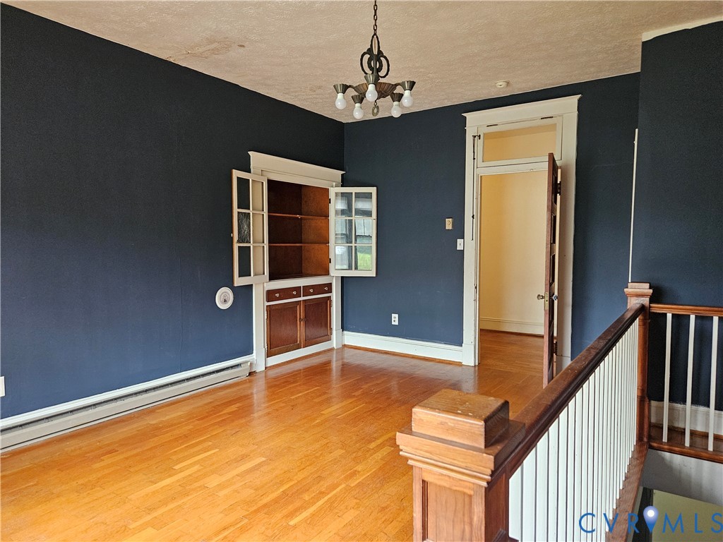 16124 Beaverdam School Road Beaverdam, VA 23015 - Photo 35 of 50 a view of an empty room with wooden floor and a window