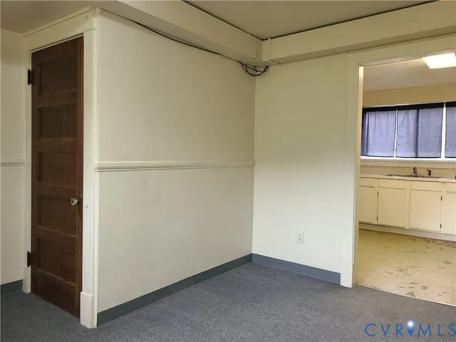 a kitchen with a sink and large window