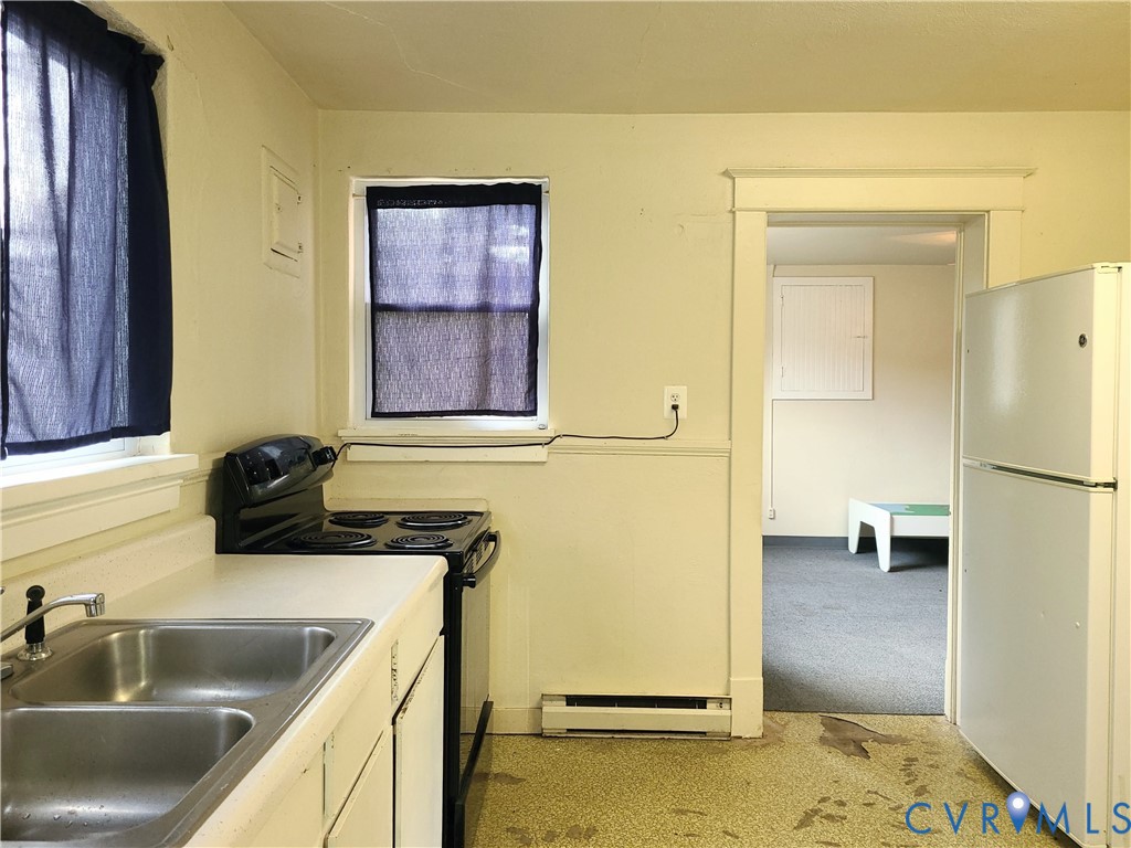 16124 Beaverdam School Road Beaverdam, VA 23015 - Photo 42 of 50 a kitchen with a sink and a refrigerator