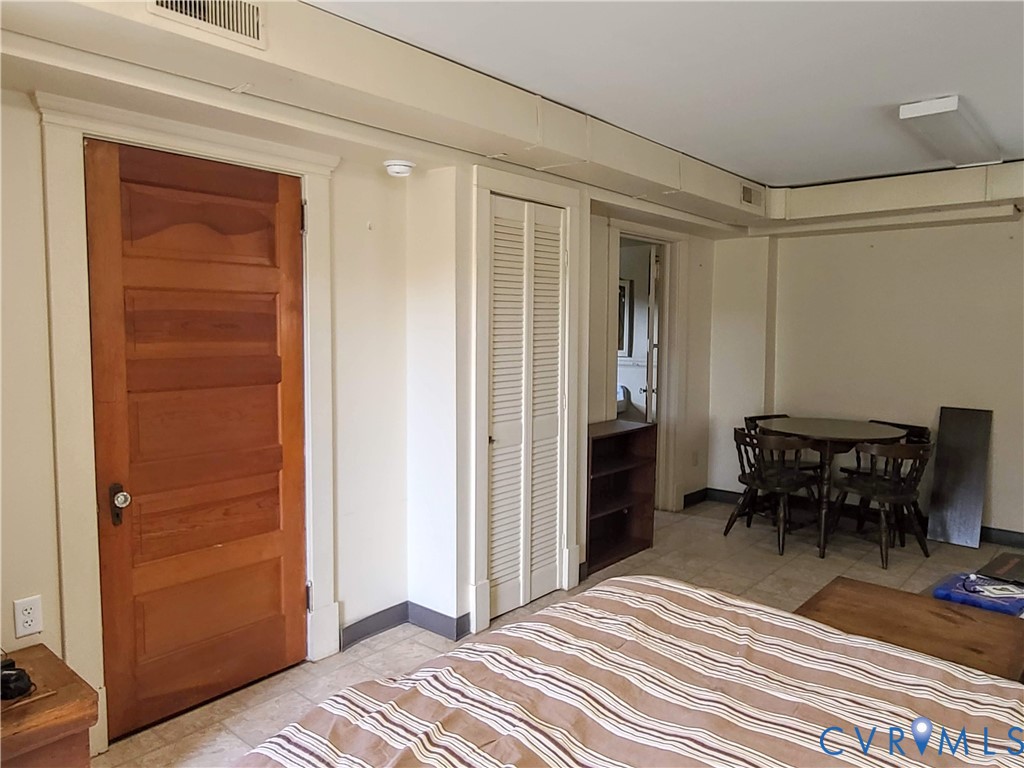 16124 Beaverdam School Road Beaverdam, VA 23015 - Photo 47 of 50 a bedroom with a bed and a table in it