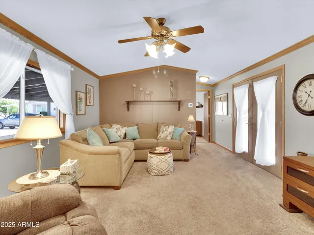 a living room with furniture and a window