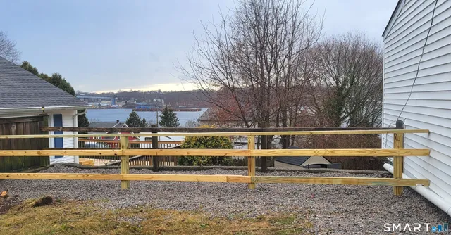 a view of swimming pool with outdoor seating and yard in the back