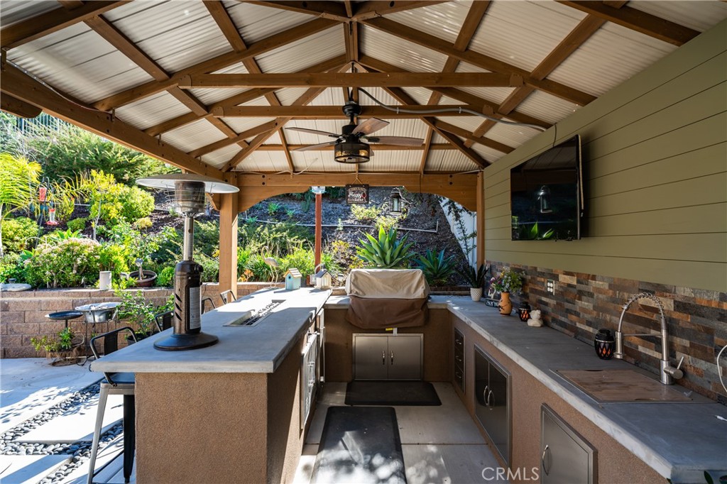 11137 Briar Rose Court Corona, CA 92883 - Photo 49 of 75 a view of a porch with furniture and a yard