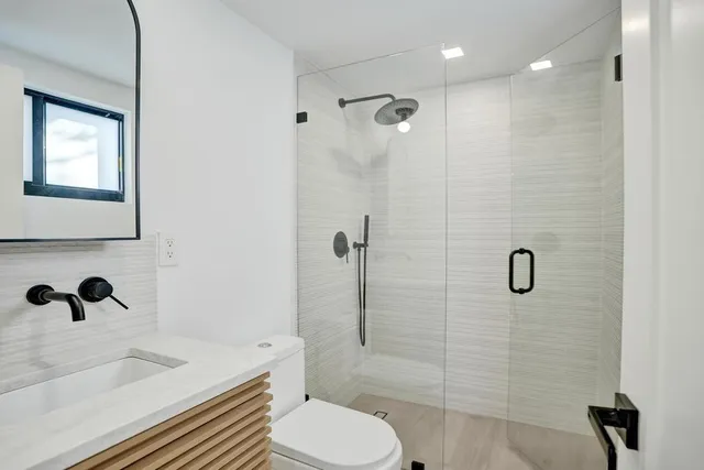 a kitchen with a refrigerator and cabinets