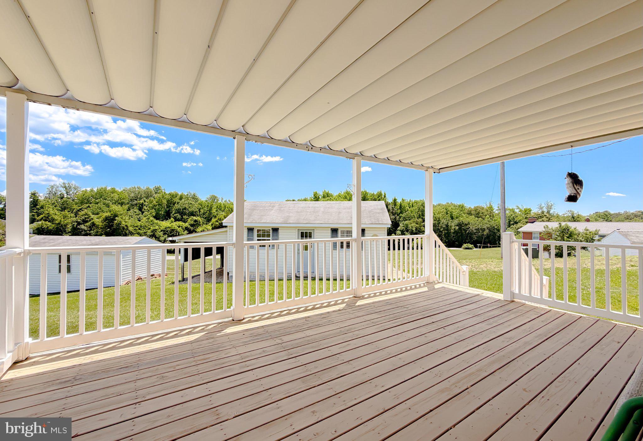 23230 Colton Point Road Avenue, MD 20609 - Photo 59 of 63 Spacious deck with serene views.