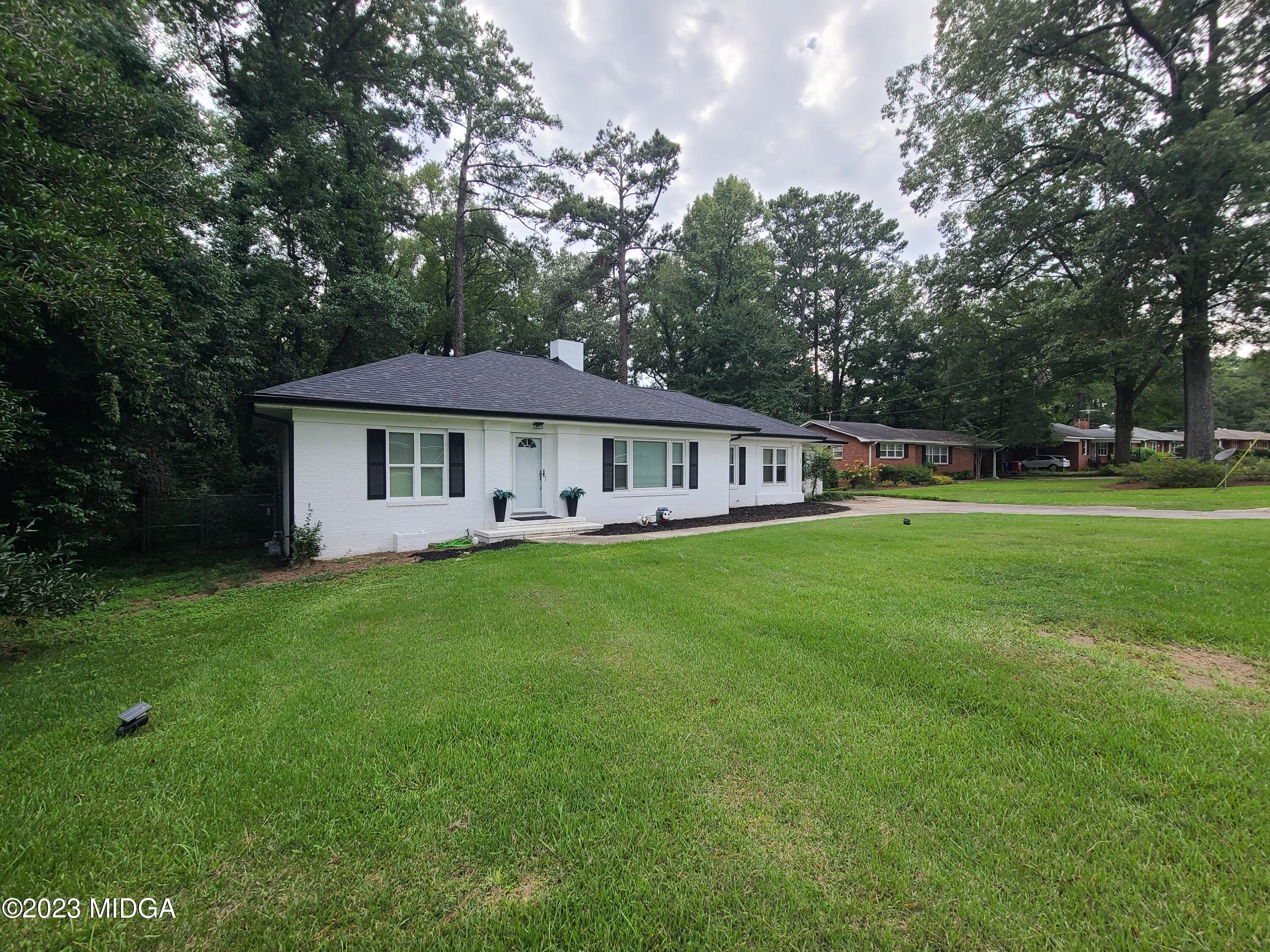 2638 Riverview Road Macon, GA 31204 - Photo 2 of 24 a front view of a house with yard and green space