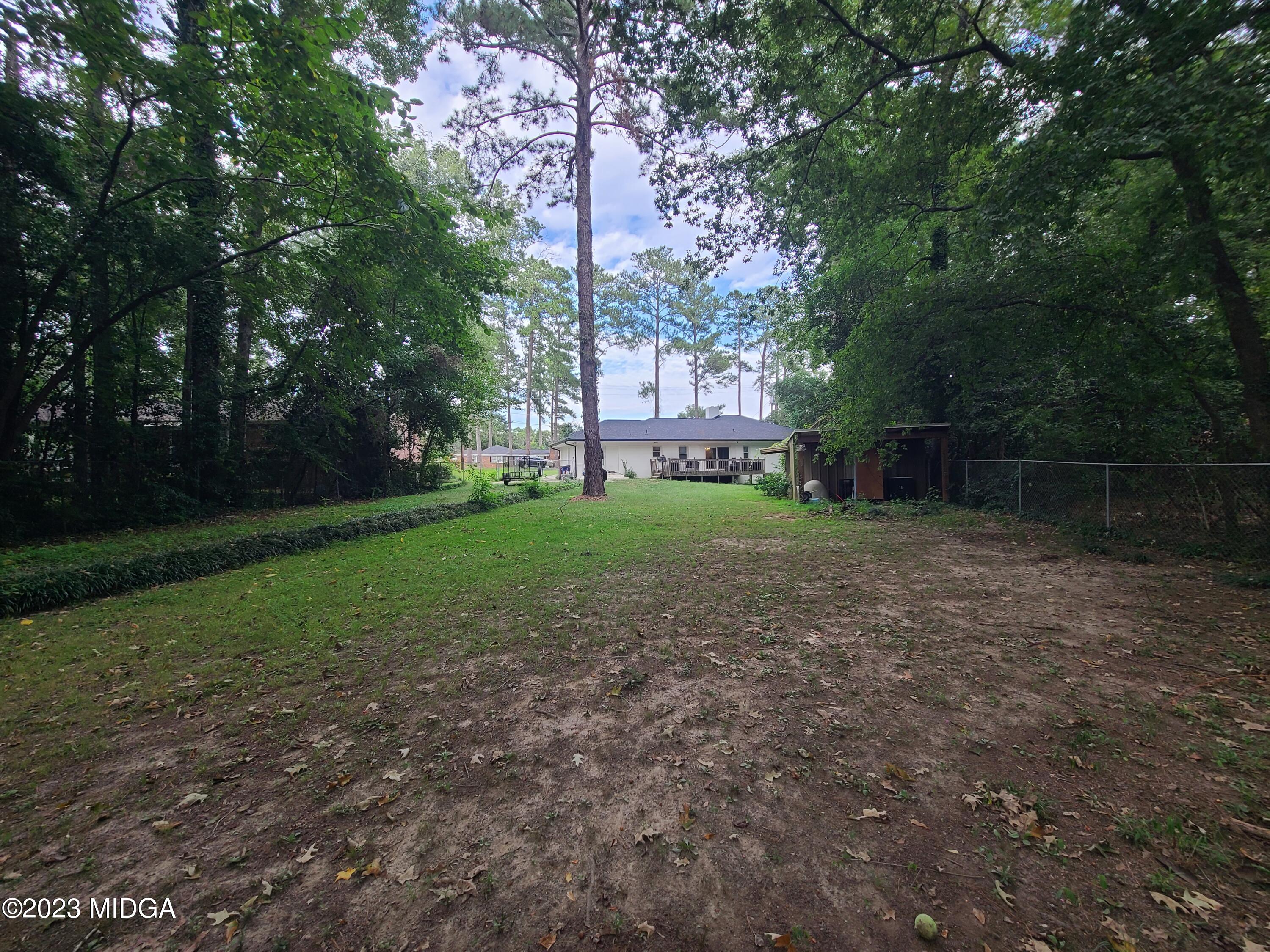 2638 Riverview Road Macon, GA 31204 - Photo 24 of 24 a view of a yard with tree s