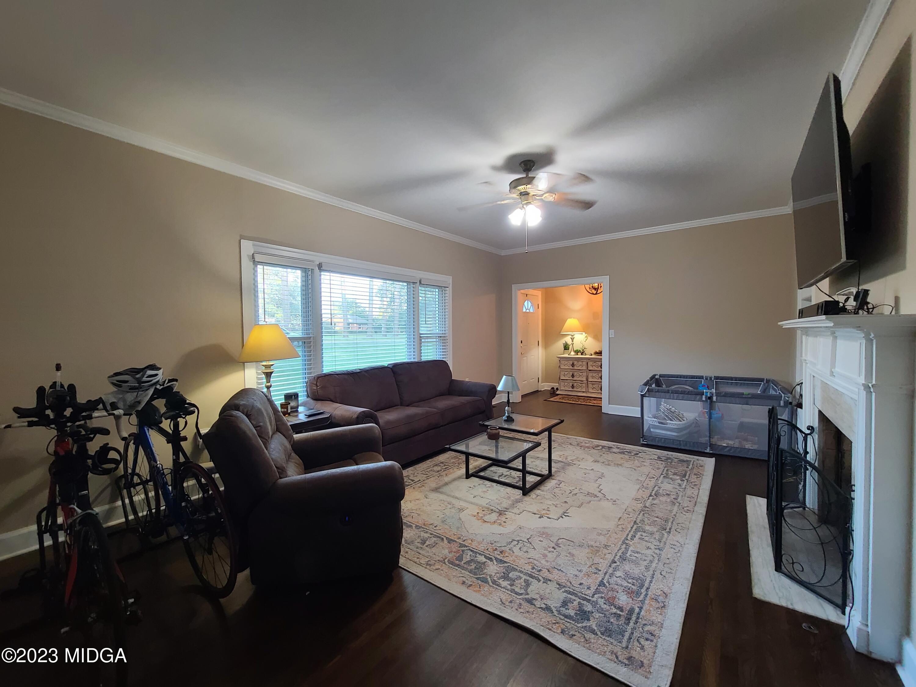 2638 Riverview Road Macon, GA 31204 - Photo 4 of 24 a living room with furniture a flat screen tv and a window