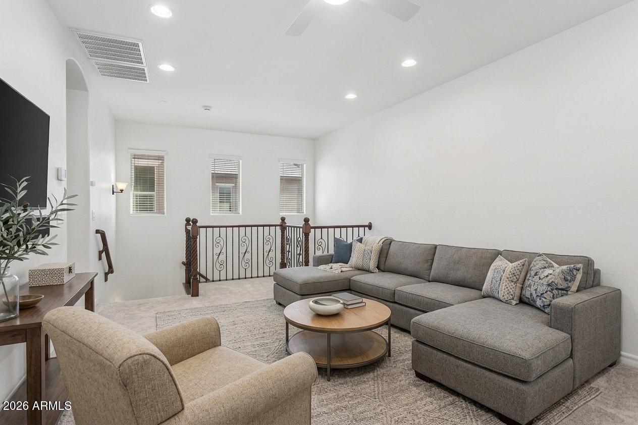 922 South Agnes Lane Gilbert, AZ 85296 - Photo 15 of 43 a living room with furniture and a flat screen tv