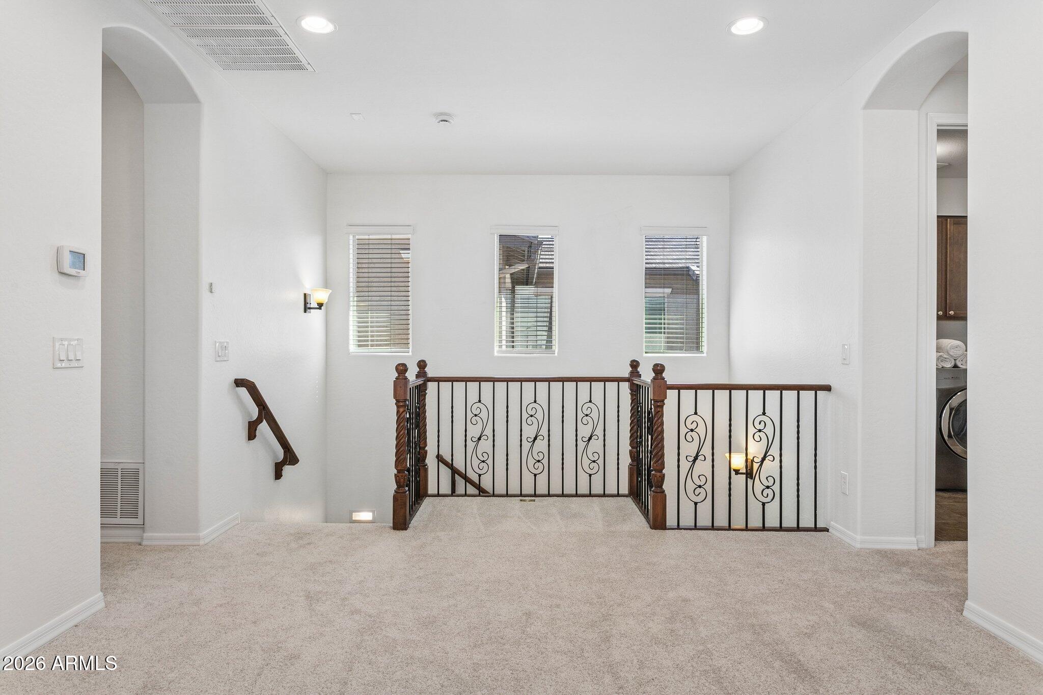 922 South Agnes Lane Gilbert, AZ 85296 - Photo 16 of 43 a view of a hallway with windows