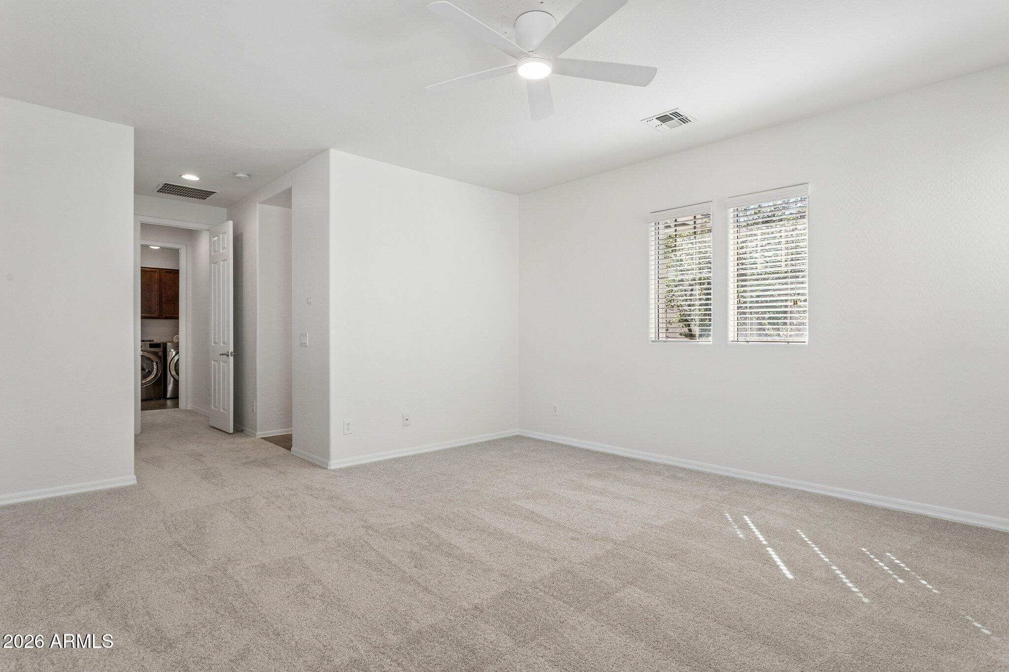 922 South Agnes Lane Gilbert, AZ 85296 - Photo 18 of 43 an empty room with windows and closet