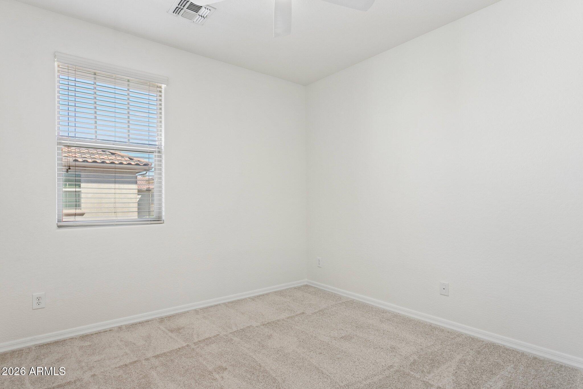 922 South Agnes Lane Gilbert, AZ 85296 - Photo 24 of 43 an empty room with a window