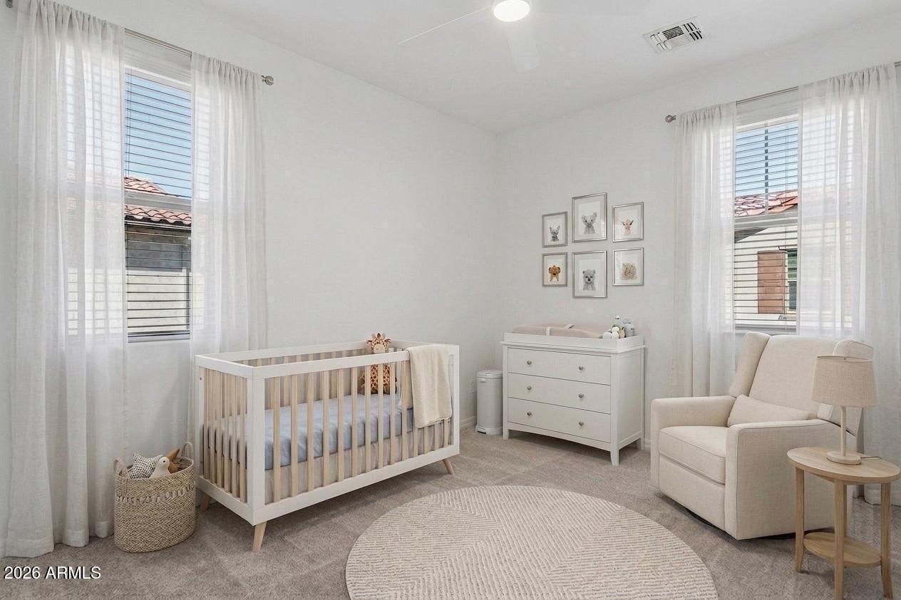 922 South Agnes Lane Gilbert, AZ 85296 - Photo 28 of 43 a bedroom with a bed and a window