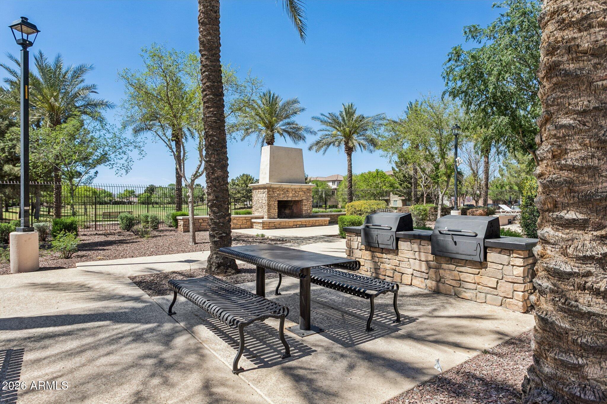 922 South Agnes Lane Gilbert, AZ 85296 - Photo 37 of 43 a view of a backyard with a patio and swimming pool