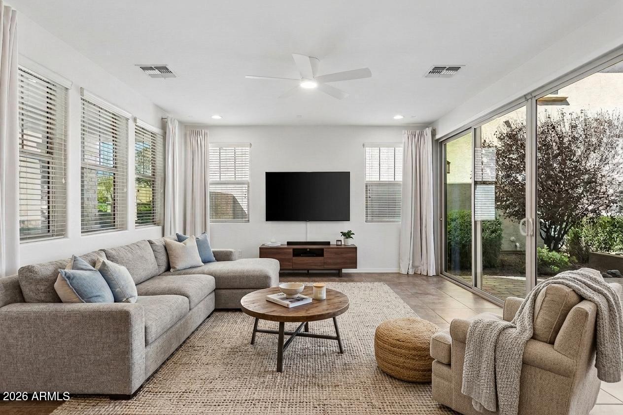 922 South Agnes Lane Gilbert, AZ 85296 - Photo 3 of 43 a living room with furniture and a flat screen tv