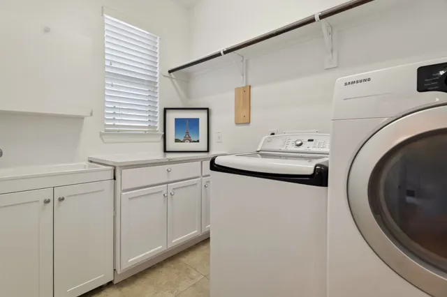 a kitchen with sink a washer and dryer
