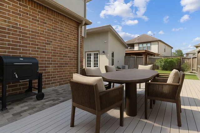 a view of a house with a chairs and a table