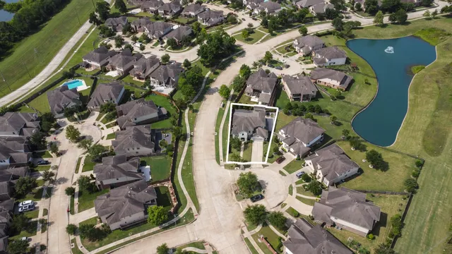 an aerial view of a swimming pool with outdoor space