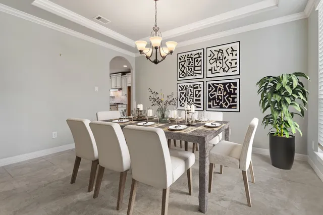 a view of a workspace with a table and a potted plant