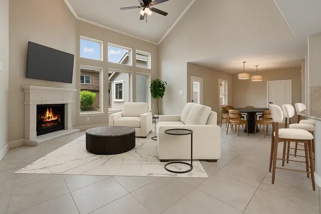 a view of a dining room with furniture and chandelier