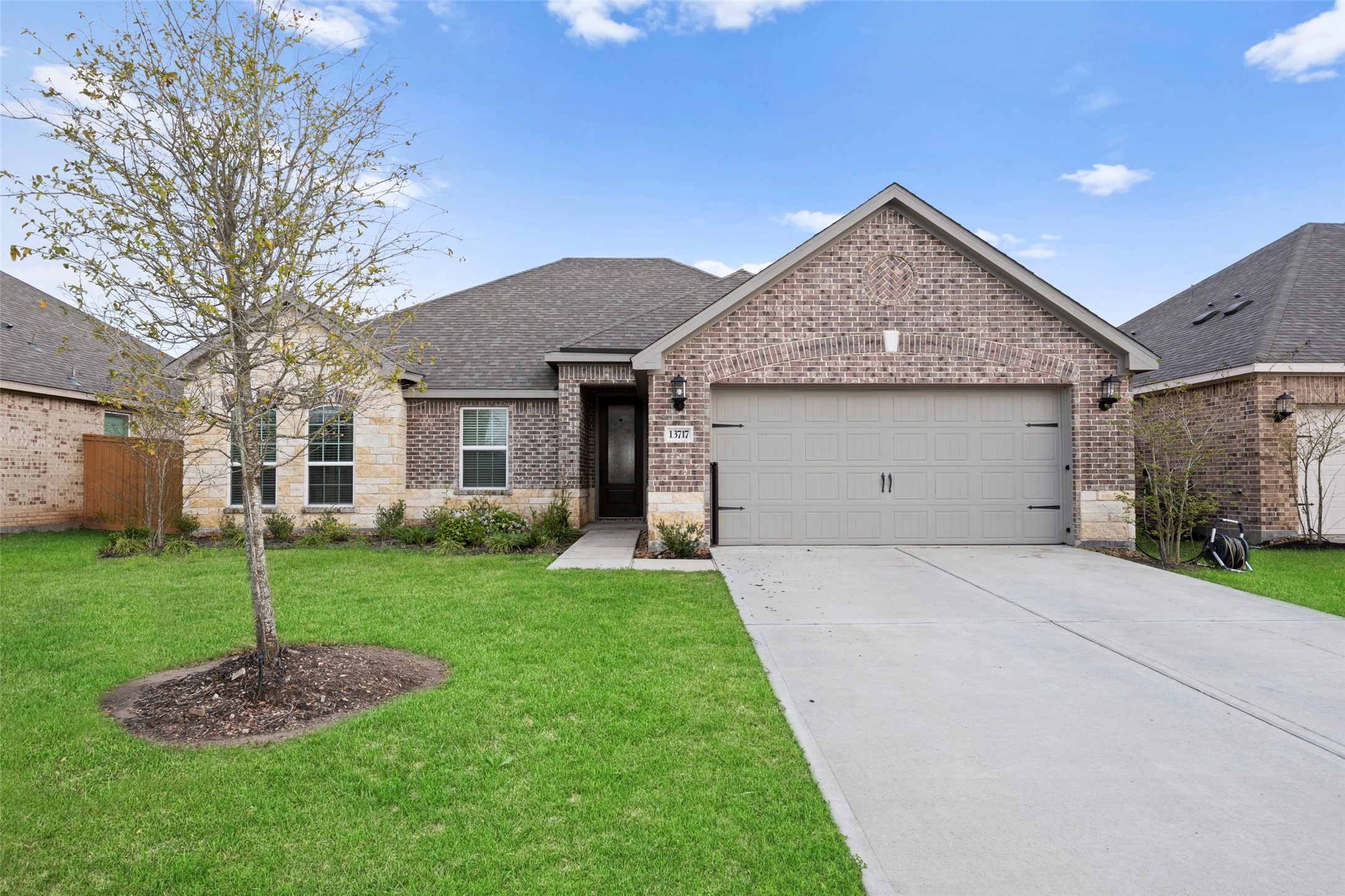 13717 Gaff Rig Drive Texas City, TX 77510 - Photo 1 of 28 a front view of a house with a garden