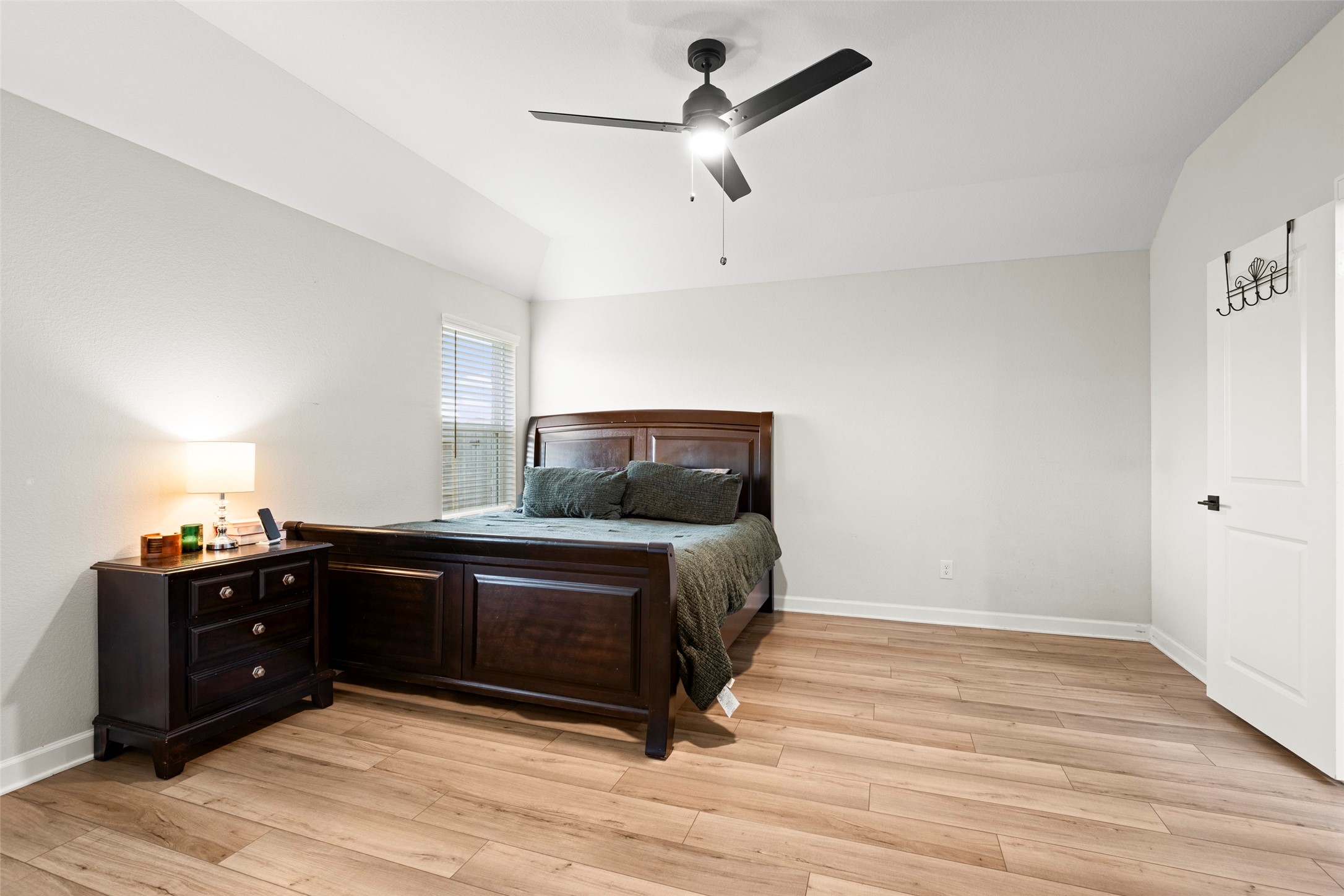 13717 Gaff Rig Drive Texas City, TX 77510 - Photo 17 of 28 a bedroom with a bed and a dresser