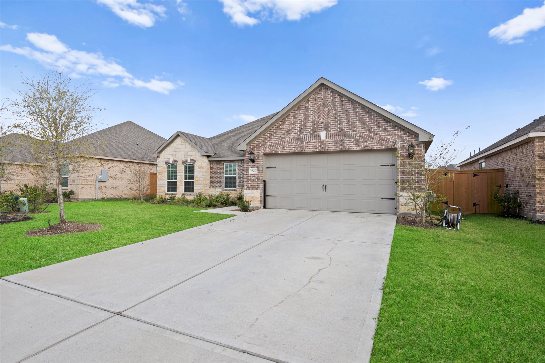 13717 Gaff Rig Drive Texas City, TX 77510 - Photo 2 of 28 a view of a house with a yard and garage