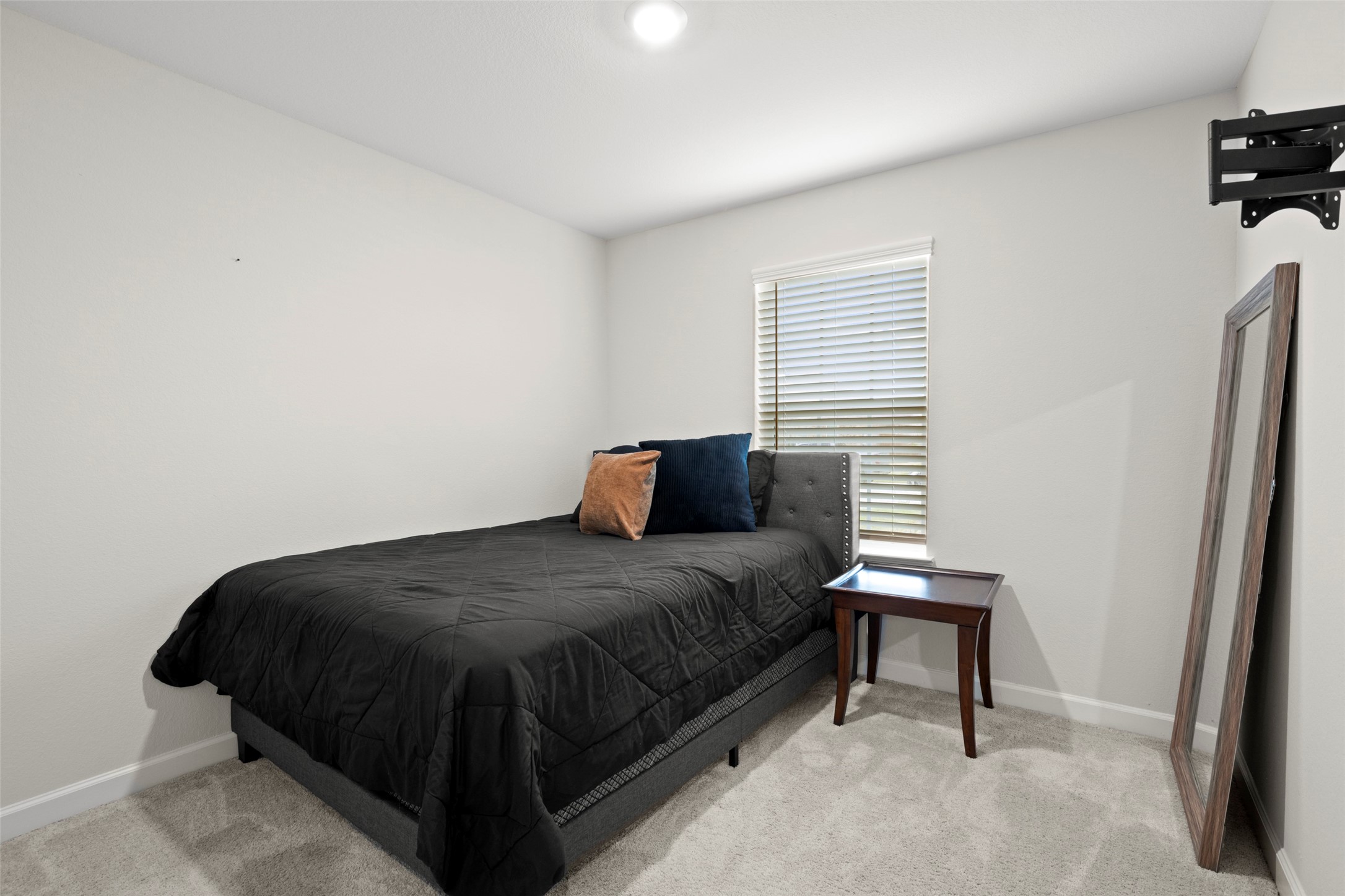 13717 Gaff Rig Drive Texas City, TX 77510 - Photo 21 of 28 a bedroom with a bed and a window