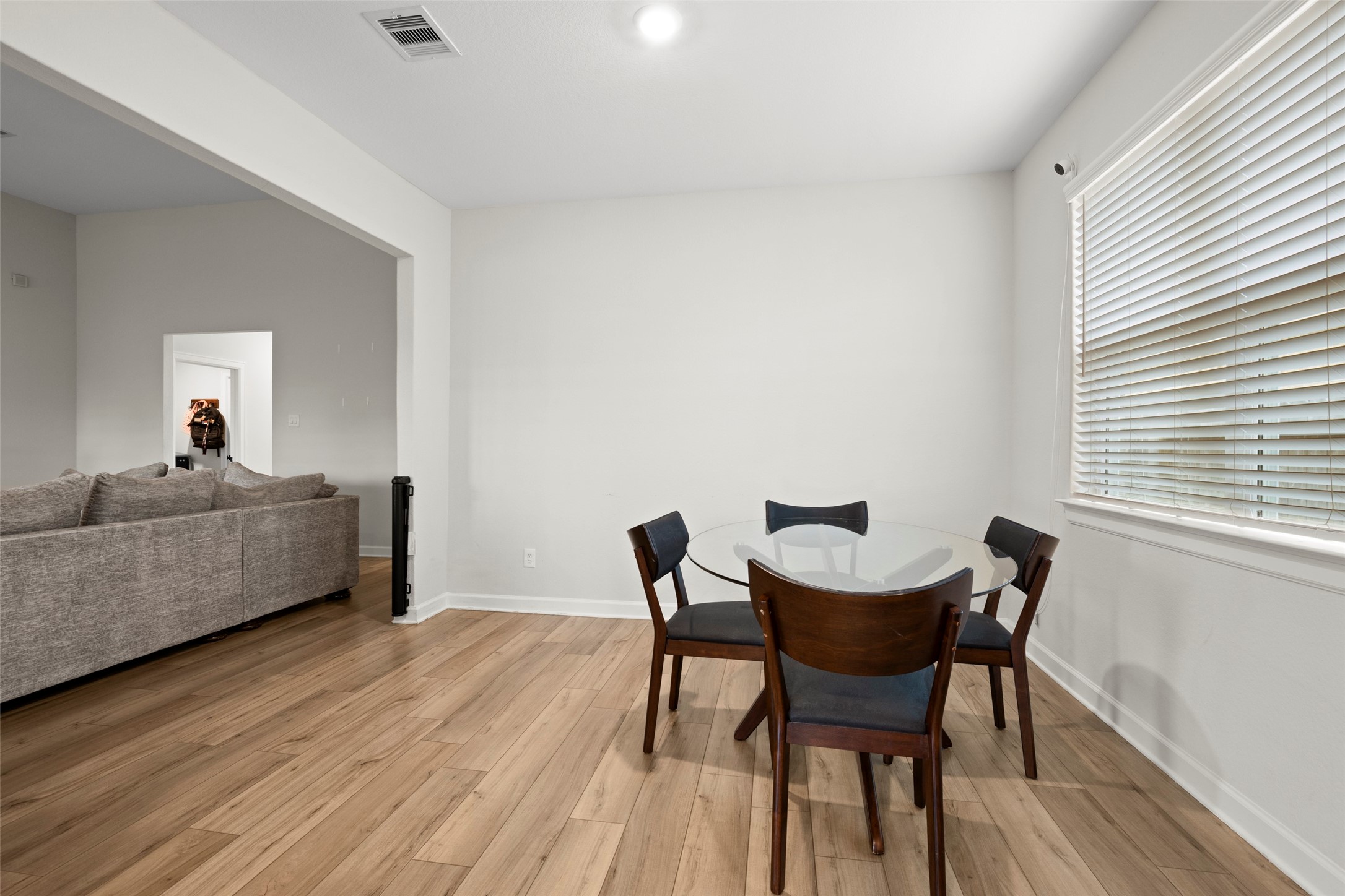 13717 Gaff Rig Drive Texas City, TX 77510 - Photo 10 of 28 a view of a dining room with furniture and wooden floor