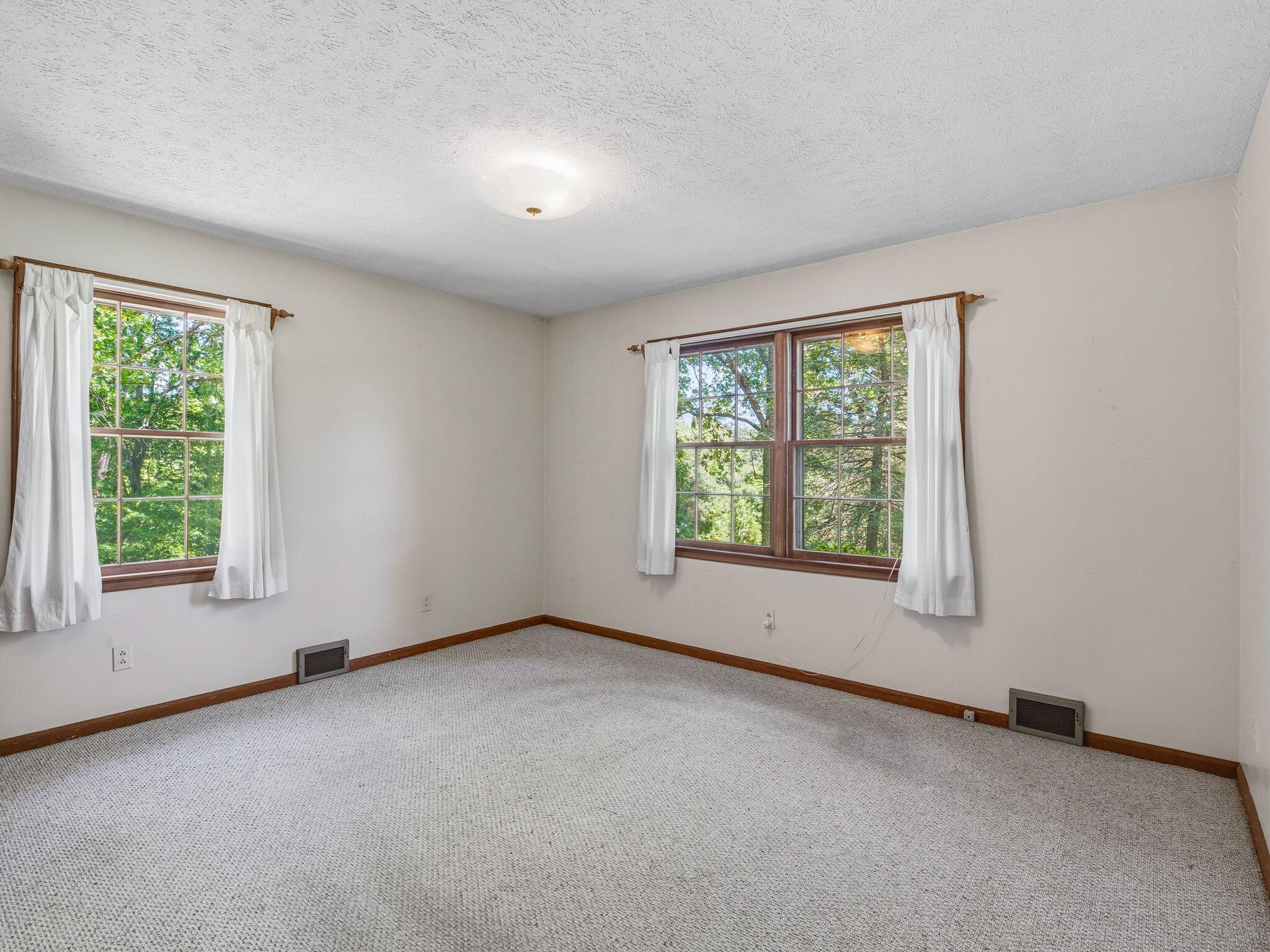1115 Robin Ridge Road Henry, VA 24102 - Photo 23 of 54 an empty room with windows
