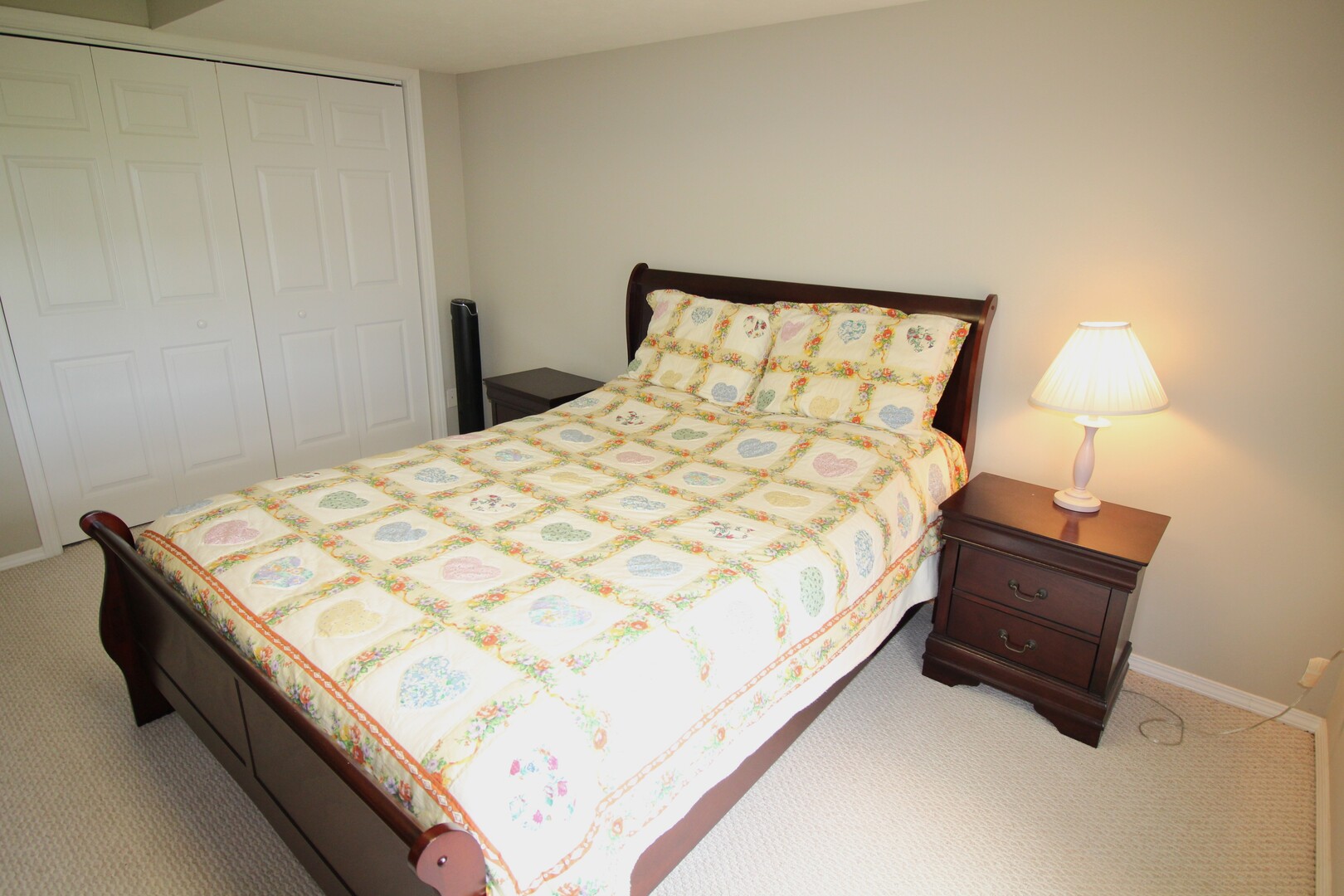 25 Oak Park Road Bloomington, IL 61701 - Photo 20 of 28 a large bed sitting in a bedroom next to a lamp