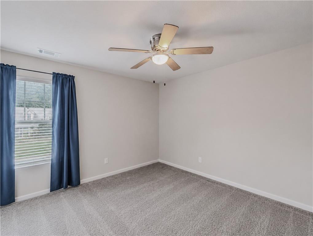 206 Morning Drive Athens, GA 30606 - Photo 20 of 36 an empty room with a window and a fan