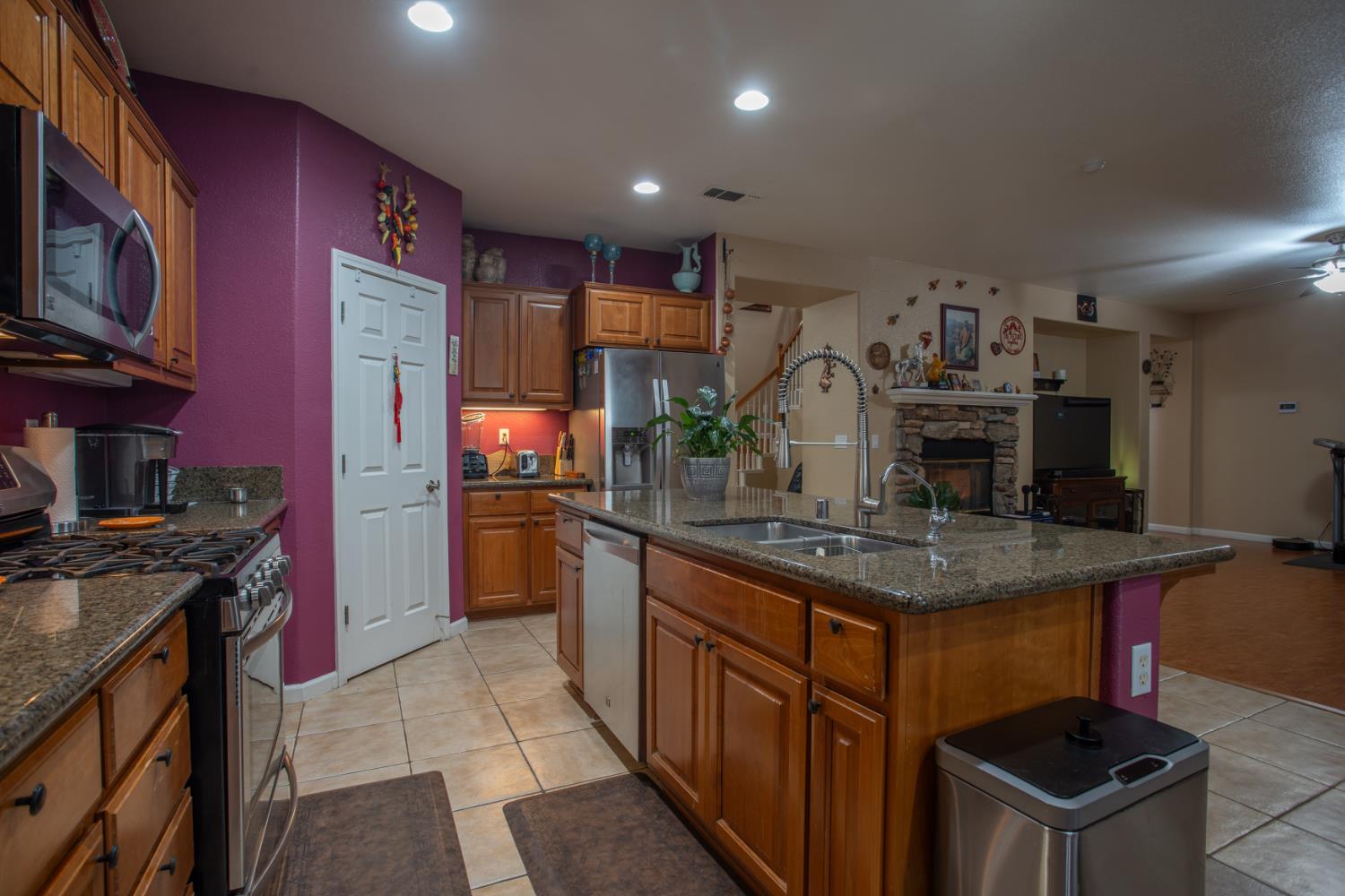 11740 Mani Circle Rancho Cordova, CA 95742 - Photo 14 of 50 a kitchen with stainless steel appliances granite countertop a stove and a sink