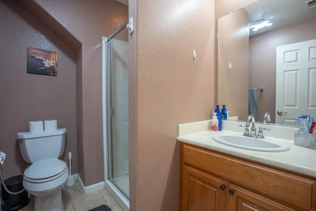 a bathroom with a sink toilet and mirror