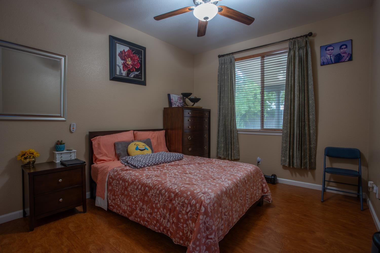 11740 Mani Circle Rancho Cordova, CA 95742 - Photo 23 of 50 a bedroom with a bed and a chandelier