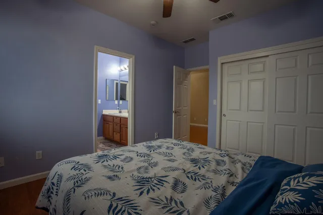 a bedroom with a bed and a dresser