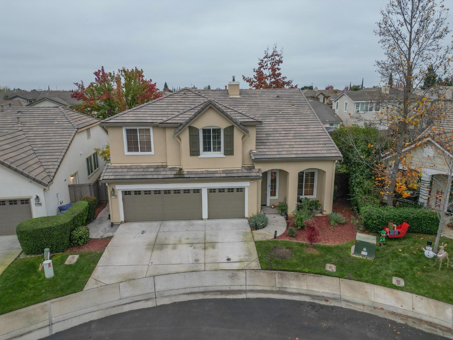 11740 Mani Circle Rancho Cordova, CA 95742 - Photo 4 of 50 a front view of a house with a yard and a garage