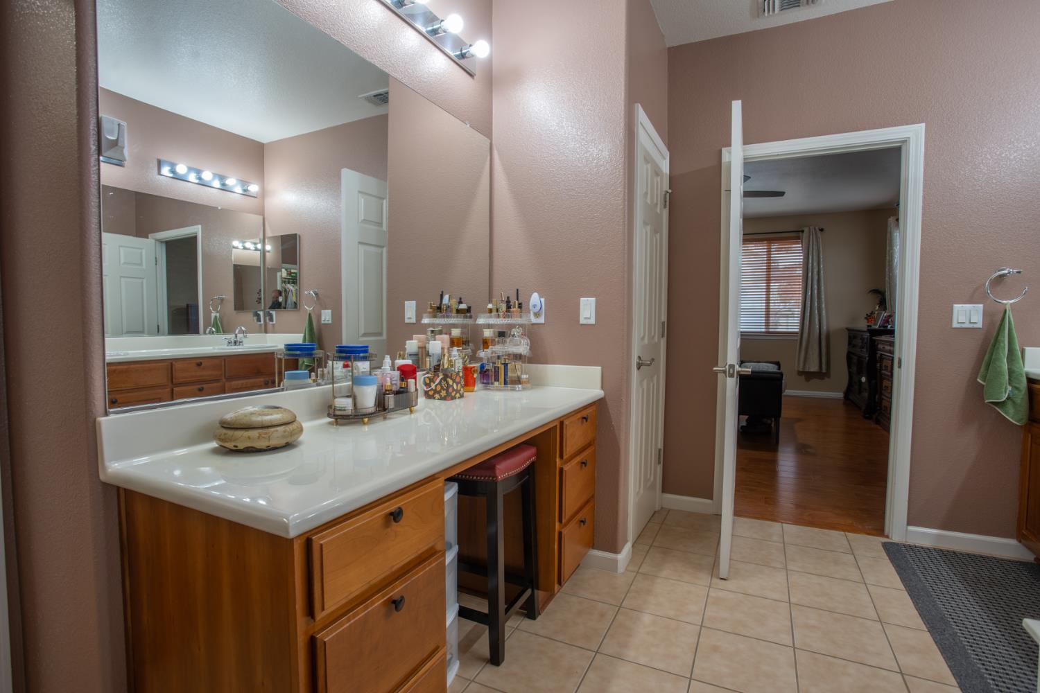 11740 Mani Circle Rancho Cordova, CA 95742 - Photo 44 of 50 a bathroom with a sink a vanity and a mirror